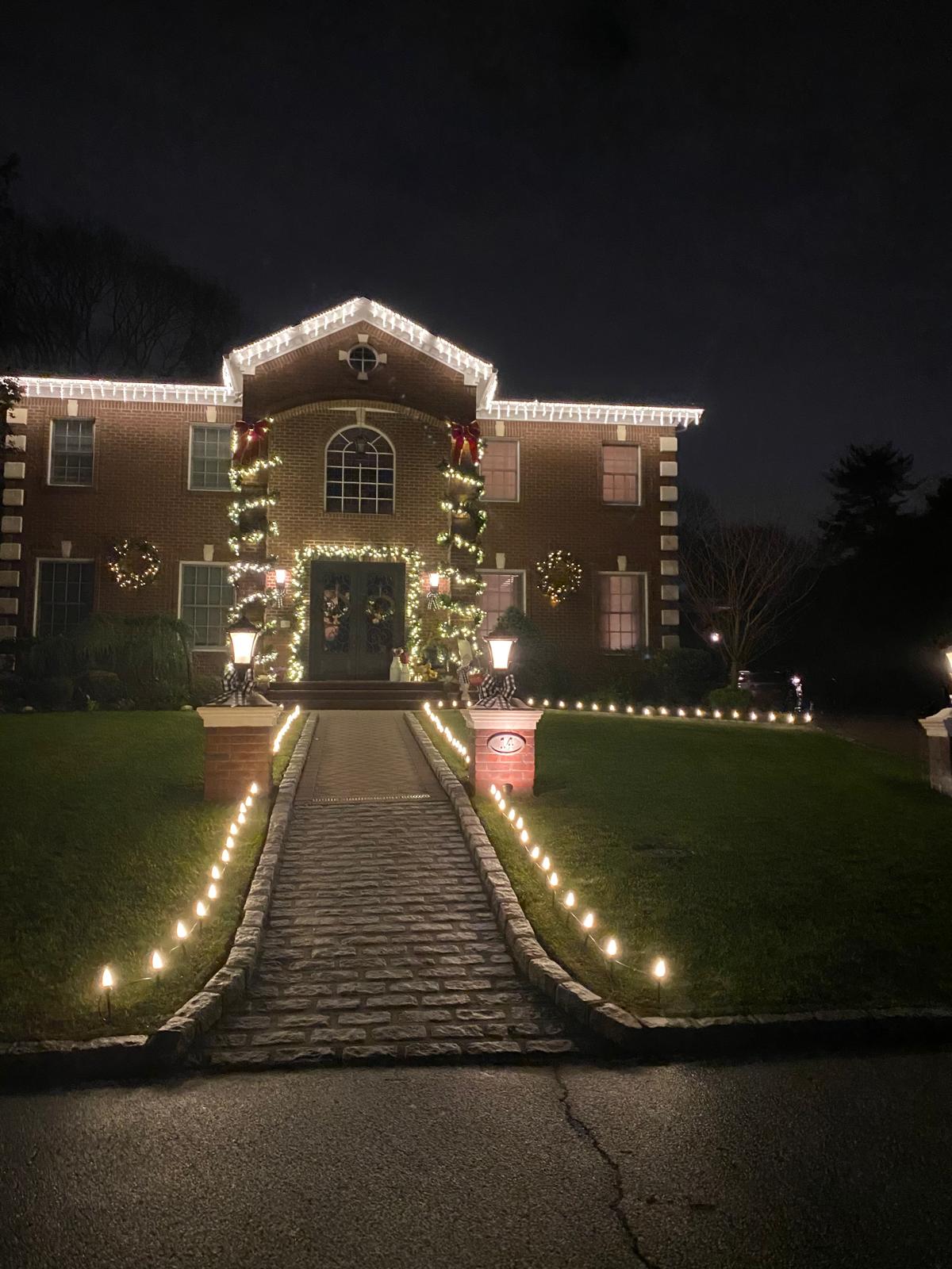 christmas lights installed on sidewalk and driveway